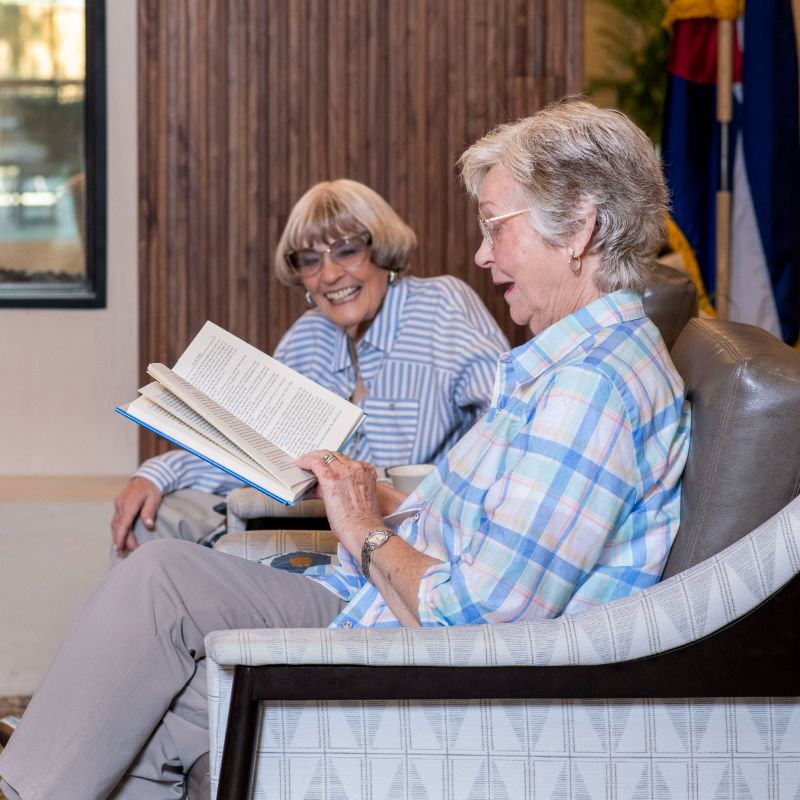 Someren Glen Senior Living Community in Centennial, CO - residents laughing during book club square